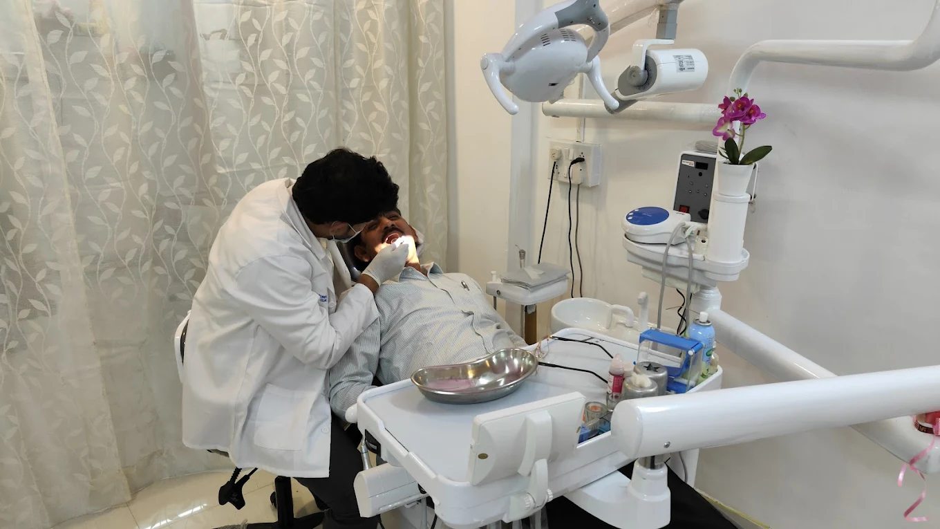 Dr. Anurag Gautam treating a patient at Smile Forever Dental Clinic